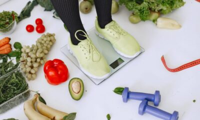 A spread of healthy weight loss foods including vegetables, eggs, nuts, and fruit