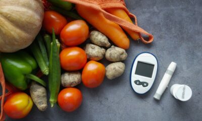 A variety of healthy foods including leafy greens, berries, nuts, and legumes known to help lower blood sugar naturally