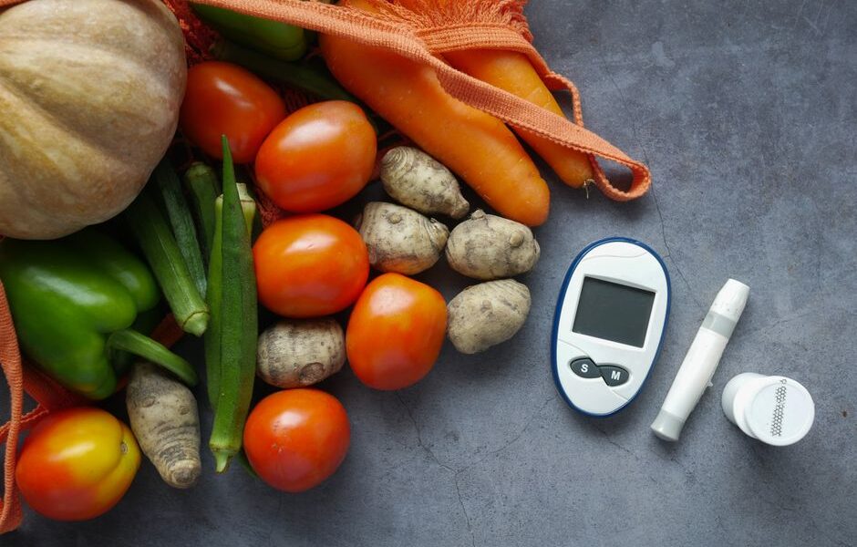 A variety of healthy foods including leafy greens, berries, nuts, and legumes known to help lower blood sugar naturally