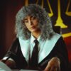 Criminal defense lawyer in Florida discussing a case with a client in a courtroom setting