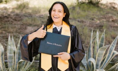 Graduate students celebrating at a California MBA program graduation ceremony