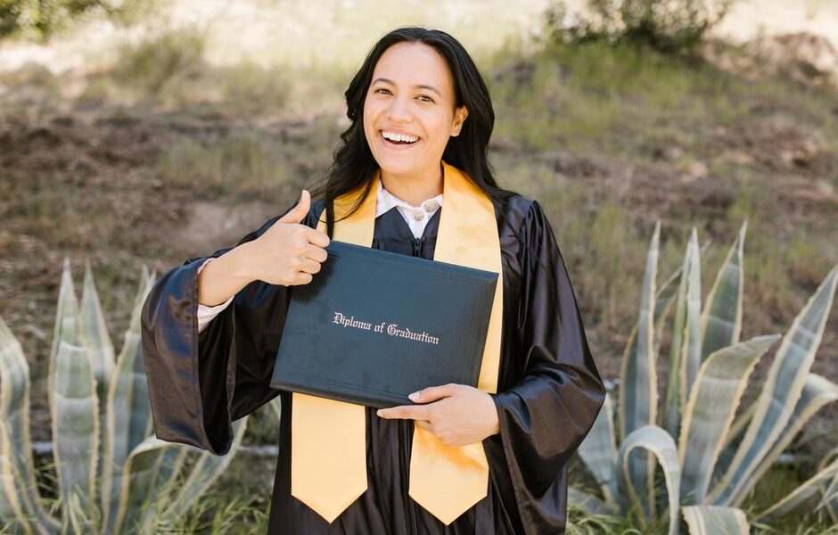 Graduate students celebrating at a California MBA program graduation ceremony