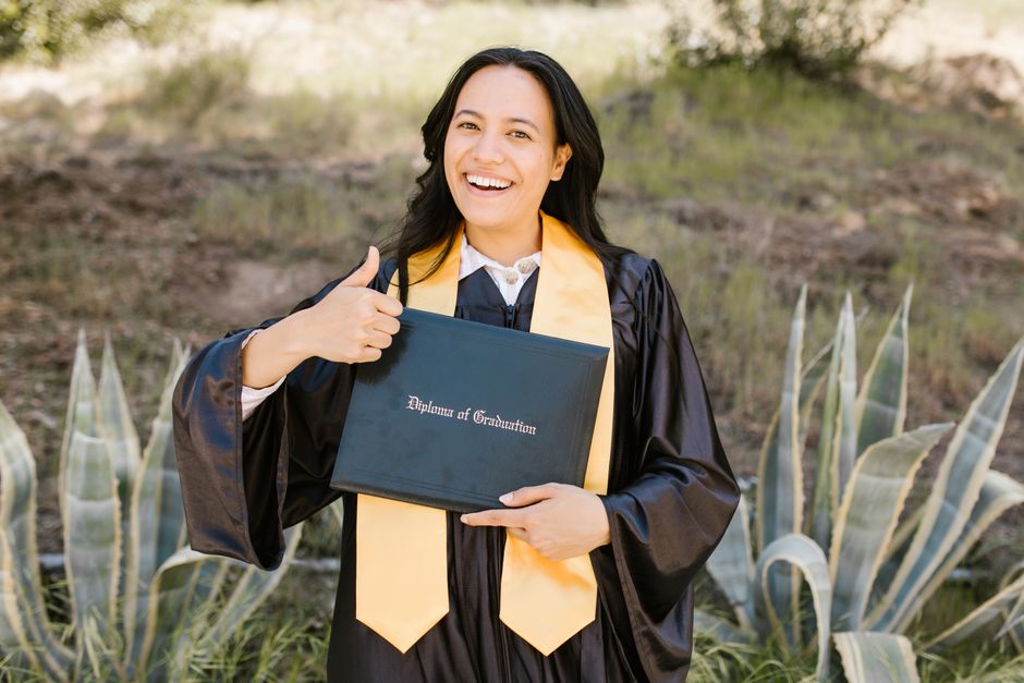 Graduate students celebrating at a California MBA program graduation ceremony