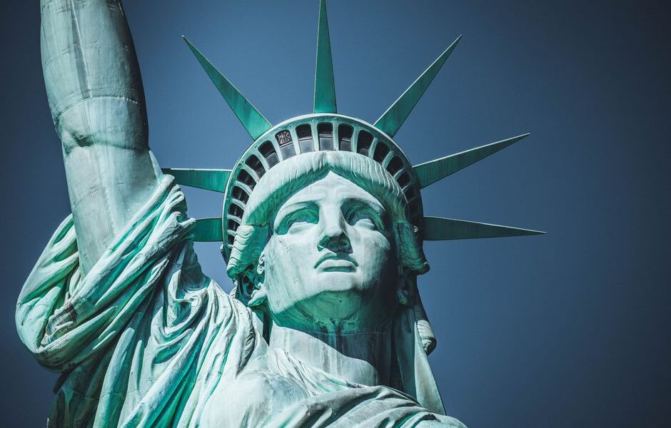 Immigration lawyer consulting with a client in a New York City office