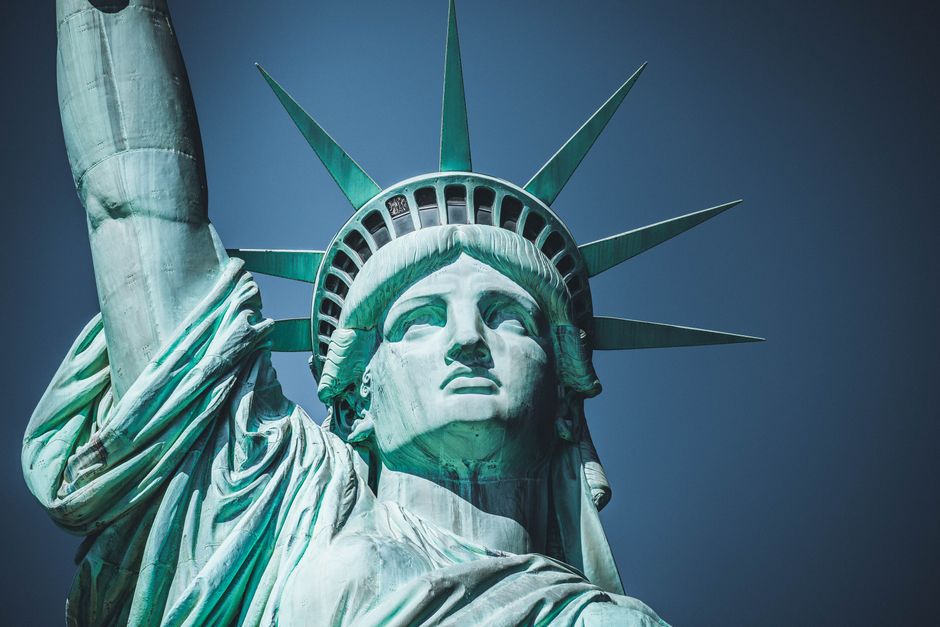Immigration lawyer consulting with a client in a New York City office