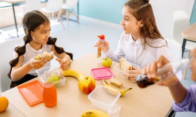 Kids enjoying colorful after-school snacks at a kitchen table