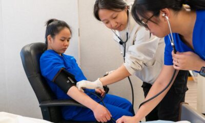 Nursing students studying together in a classroom at a nursing school in New York