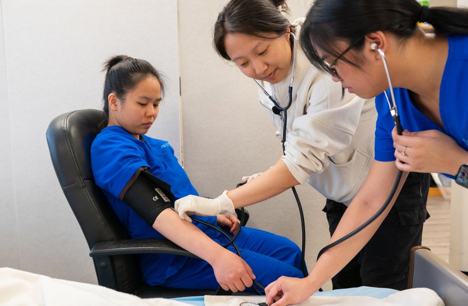Nursing students studying together in a classroom at a nursing school in New York