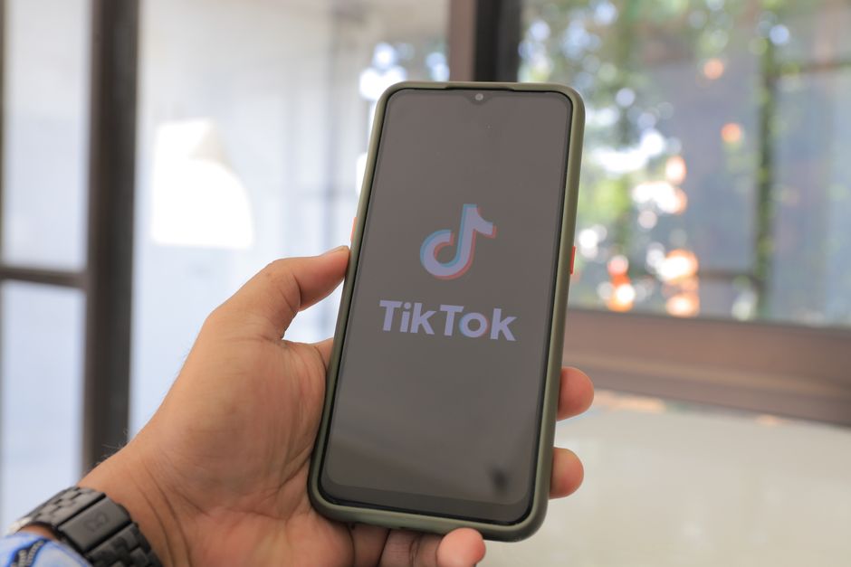Person browsing TikTok Shop on a smartphone to find the best viral products of 2025
