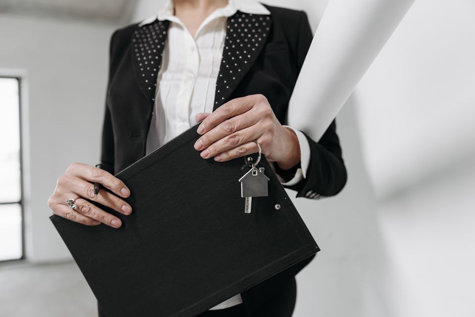 Property manager reviewing rental agreement documents in a California office
