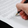 Real estate attorney reviewing property closing documents with clients in New Jersey