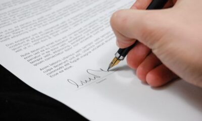 Real estate attorney reviewing property closing documents with clients in New Jersey