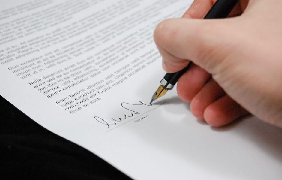 Real estate attorney reviewing property closing documents with clients in New Jersey