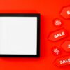 Shopping bags and sale signage representing Memorial Day weekend deals
