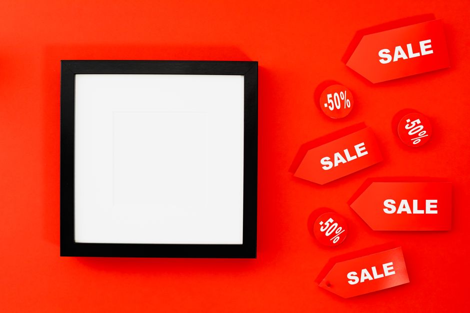 Shopping bags and sale signage representing Memorial Day weekend deals