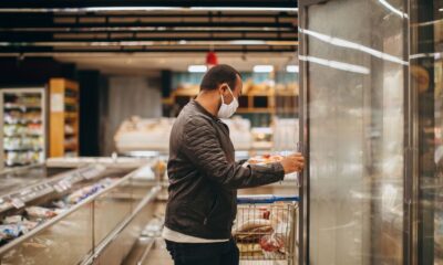 Shopping cart filled with items inside a Costco warehouse store