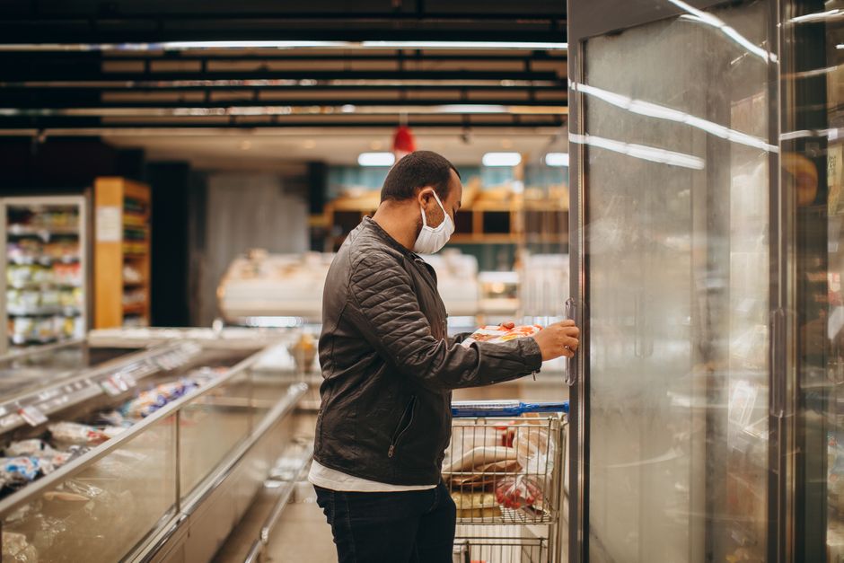 Shopping cart filled with items inside a Costco warehouse store