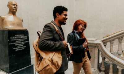 Students walking outside a prestigious law school building on a university campus