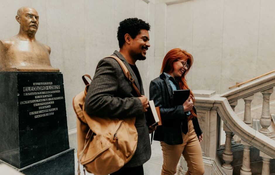 Students walking outside a prestigious law school building on a university campus