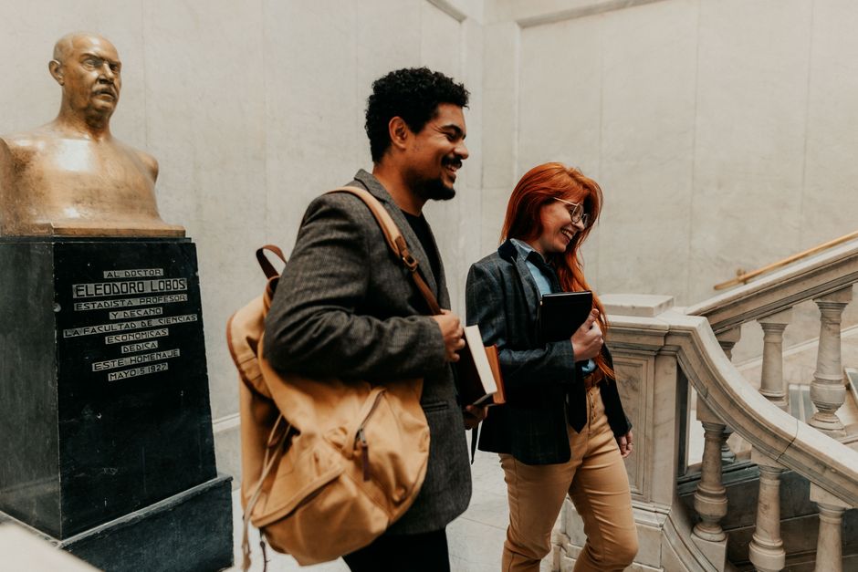 Students walking outside a prestigious law school building on a university campus
