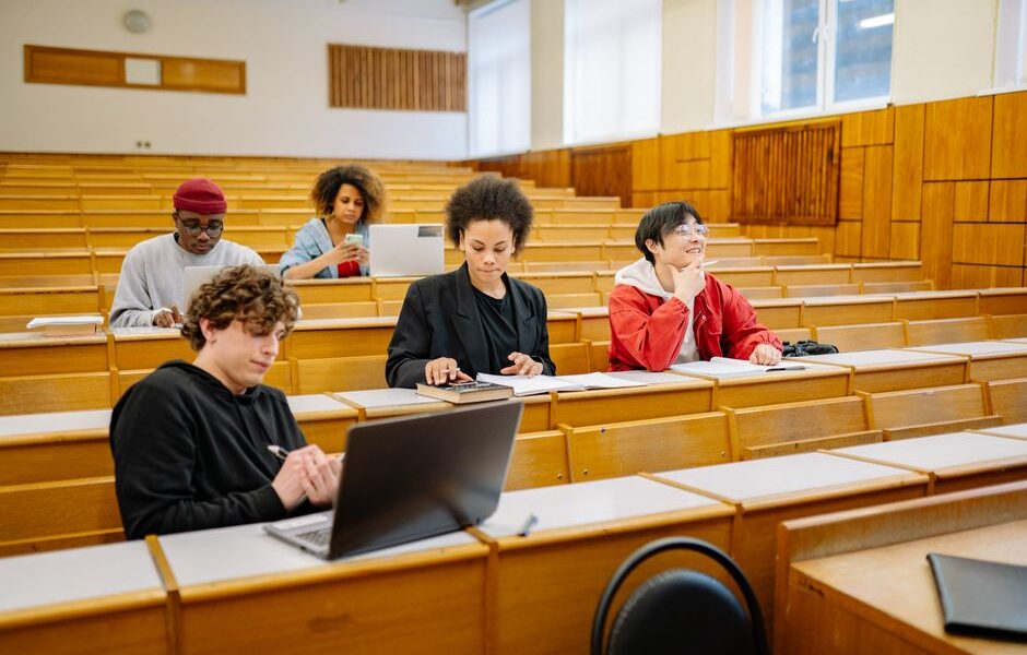 Students working on laptops during a coding bootcamp class in Texas