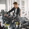 Rows of motorcycles on display inside a Florida motorcycle dealership showroom