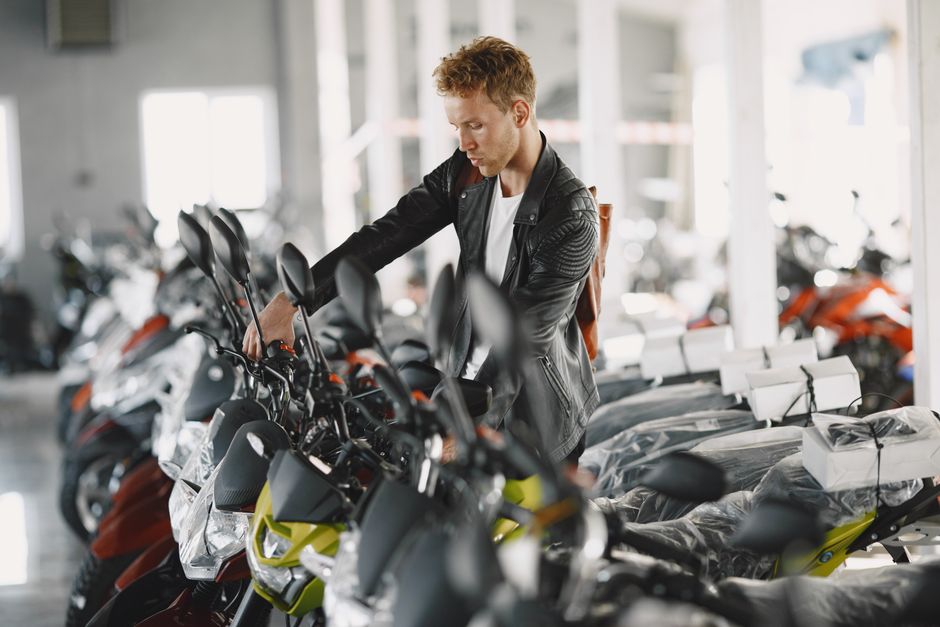 Rows of motorcycles on display inside a Florida motorcycle dealership showroom