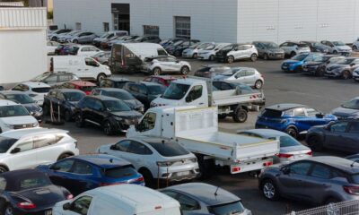 Rows of new cars parked at a car dealership in Texas
