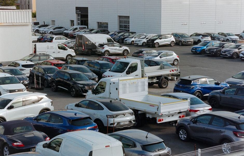 Rows of new cars parked at a car dealership in Texas