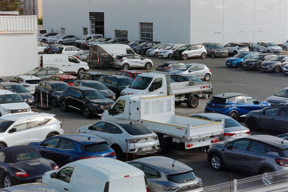 Rows of new cars parked at a car dealership in Texas