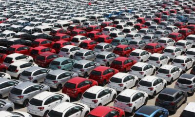 Rows of used cars for sale at a Florida car dealership lot