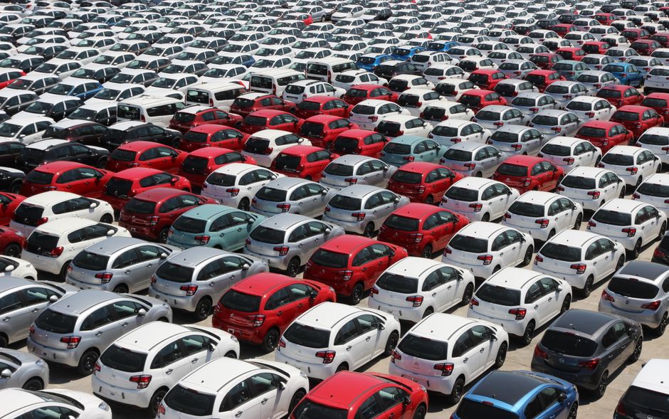 Rows of used cars for sale at a Florida car dealership lot