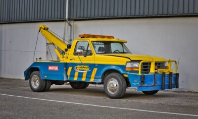 Tow truck loading a car on a Chicago city street